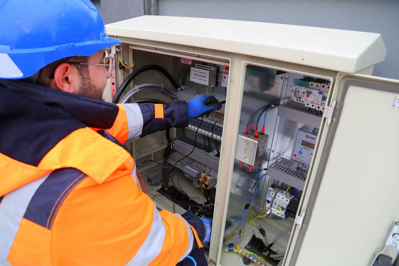 Engineer inspecting an electrical panel
